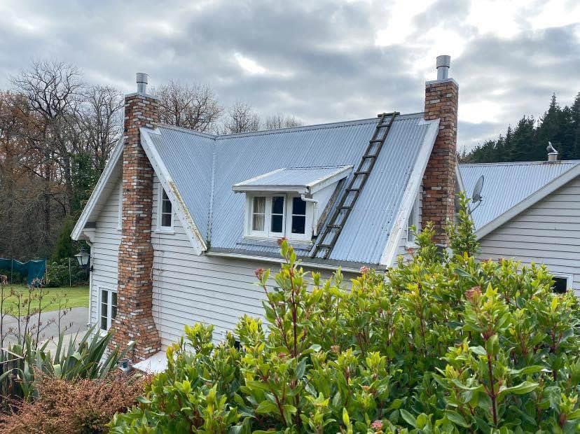 Two brick chimneys on a villa roof